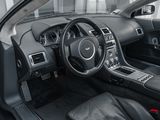 the interior of a sports car with a steering wheel and dashboard