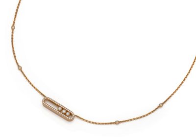 a gold necklace with a diamond bar on a chain