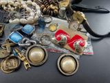 a lot of assorted jewelry on a table