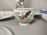a close up of a bowl and a plate on a table