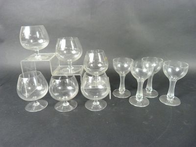 a lot of wine glasses that are sitting on a table
