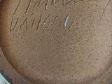 a close up of a glass jar with a chocolate drink inside of it