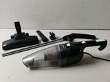 an image of a black and white vacuum cleaner and other cleaning tools
