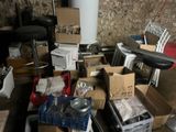 a pile of boxes and other items in a room