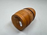 a wooden barrel that has a tag on it