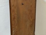 an old wooden box sitting on top of a white table