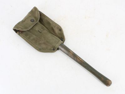 an old shovel with a pouch on it