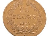 une vieille pièce française de 20 francs sur fond blanc