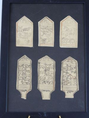a picture of a picture of a group of plaques in a black frame