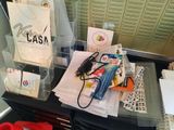 a desk with a lot of office supplies on it