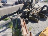 an image of a tractor that is parked on the side of the road