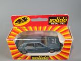 a close up of a toy car in a box on a table