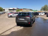 many cars parked in a parking lot in a lot