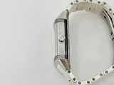 a watch that is laying on a white surface