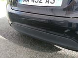 a black car that has a license plate on it