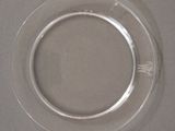 a clear glass plate with a circular design on it