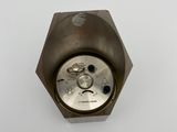 a small metal object on a white surface