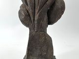sculpture of a shell on a stand on a white background