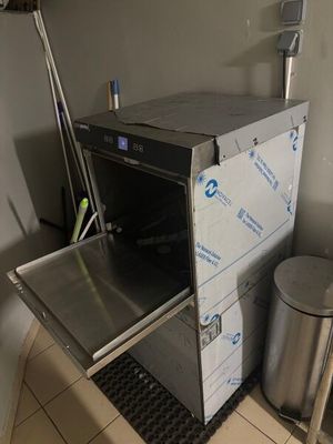 a small oven that is sitting in the corner of a room