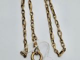 a close up of a chain with a tag attached to it