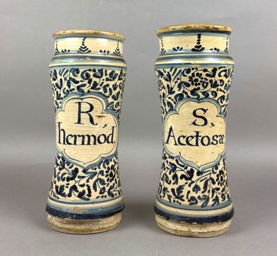 pair of blue and white ceramic vases with the words r r hammond
