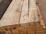 several pieces of wood are stacked on top of each other in a parking lot
