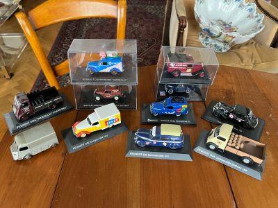 a lot of toy cars that are on the table