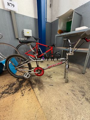 two bikes that are parked in a garage