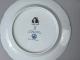a white plate with a picture of a woman on it