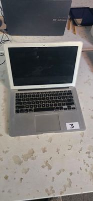 two laptops that are sitting on a table