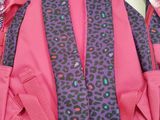 purple and pink backpack with leopard print straps and a pink backpack with purple straps and a pink backpack with purple straps and a pink backpack with a purple backpack with a