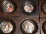 six framed pictures of a woman and a man on a wall