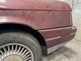 an image of a red car parked on the side of the road
