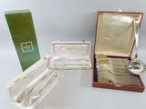 three silverplated spoons and a silverware set in a case