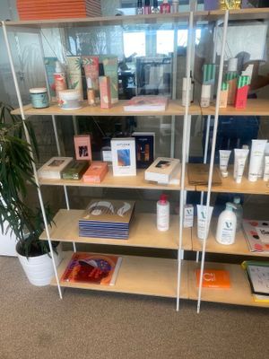 a shelf with various products on it in a room