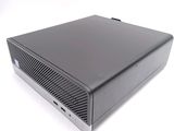 an image of a black desktop computer sitting on top of a white surface