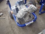 an image of a small engine on a blue cart