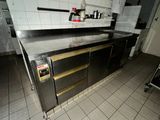 a kitchen with a stove, oven, and a dishwasher in it