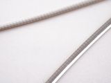 two swords that are laying next to each other on a table