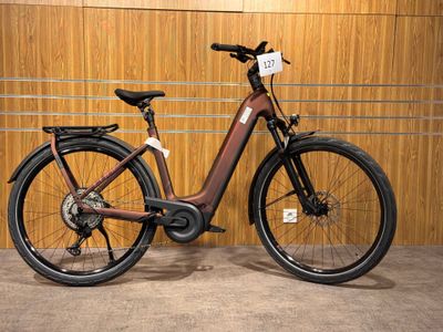 a bike that is parked in front of a wooden wall