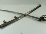 two swords that are sitting on a table