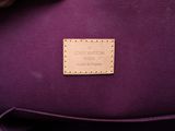 the purple bag has a leather label on it