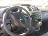 the interior of a car with a steering wheel and dashboard controls