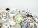 many different types of teapots and cups on the table