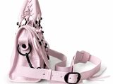 a pink purse that has a black and white design on it