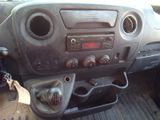 a dashboard of a car with a clock and other items