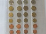a lot of coins in a plastic bag on a table