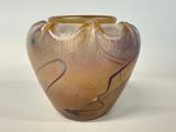 a vase that is sitting on a white surface