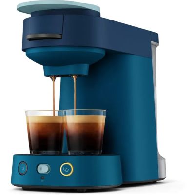 a close up of a coffee maker with two cups of coffee