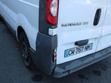 a white van that is parked in a parking lot